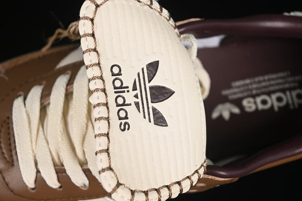 Close-up of the fold-over tongue with adidas branding