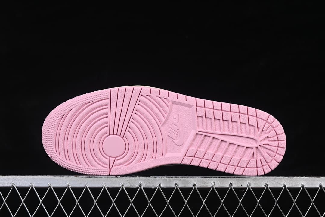 Pink outsole with circular forefoot tread and patterned grooves
