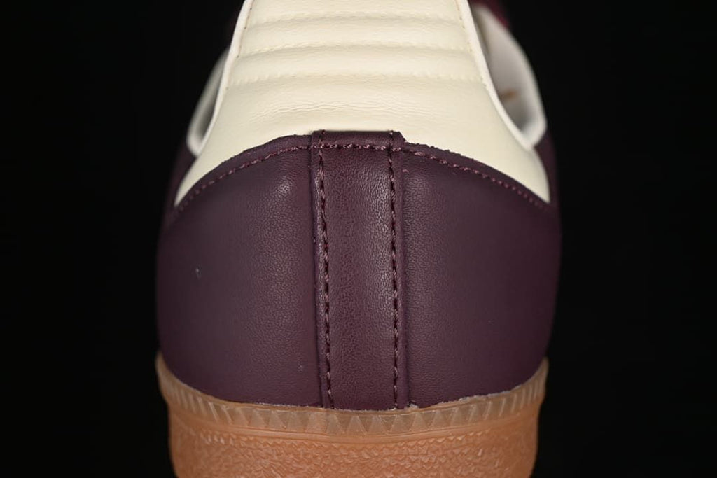 Rear close-up of the burgundy heel and cream heel tab