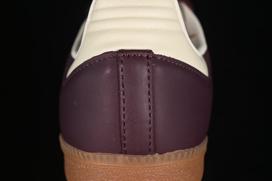 Rear close-up of the burgundy heel and cream heel tab