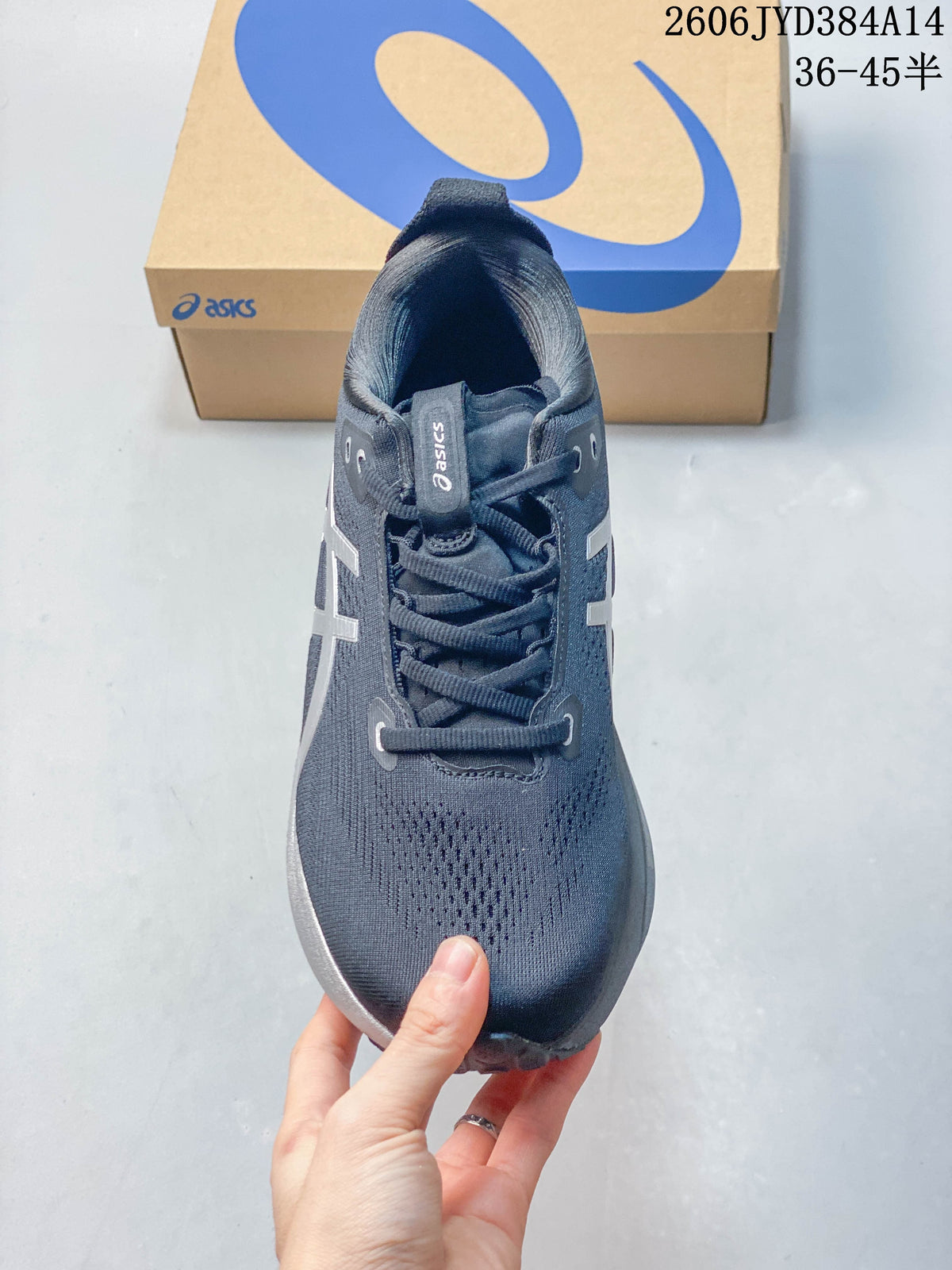 Top view of a lace-up dark navy running shoe with silver side details