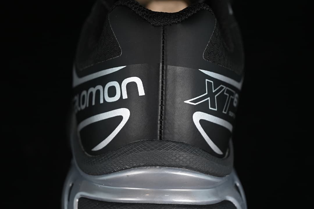 Rear view of the black and silver Salomon XT-6 GTX heel.