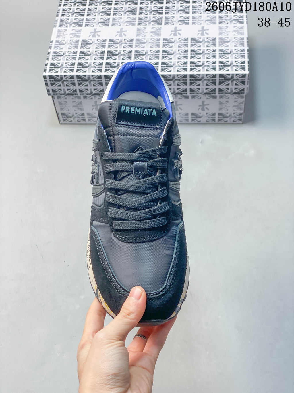 Front view of the lace-up trainer with blue lining