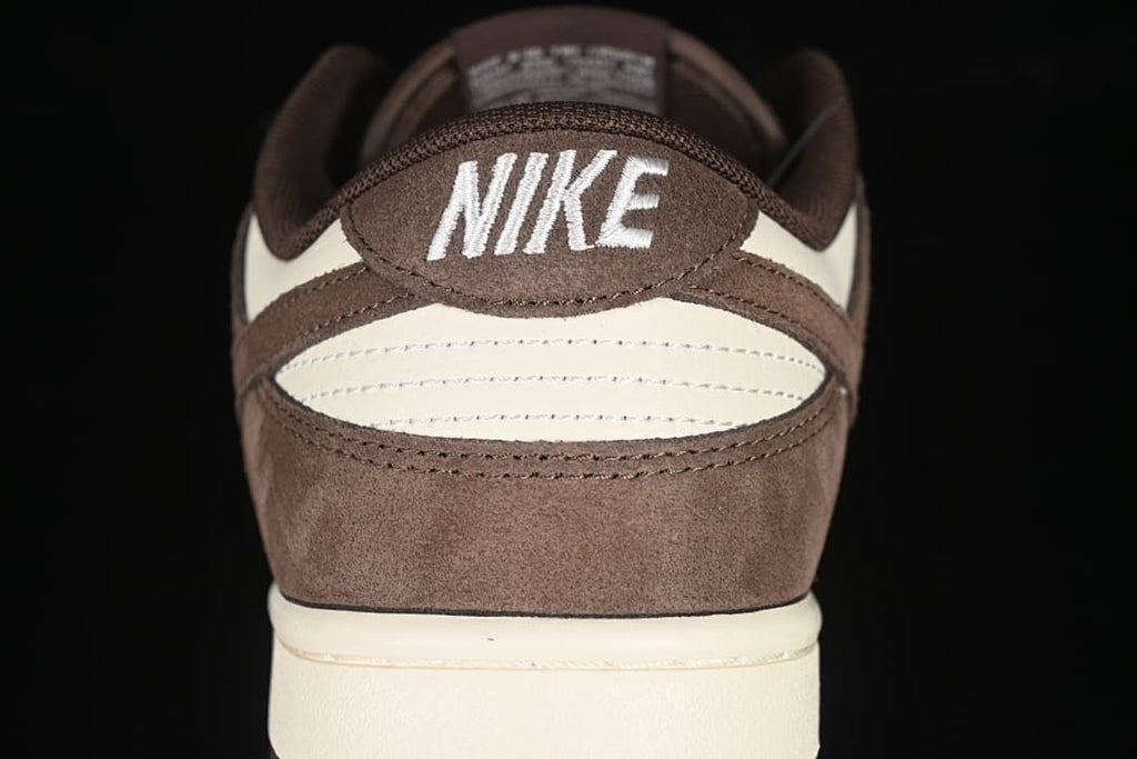 Rear view of the sneaker showing brown and off-white heel panels
