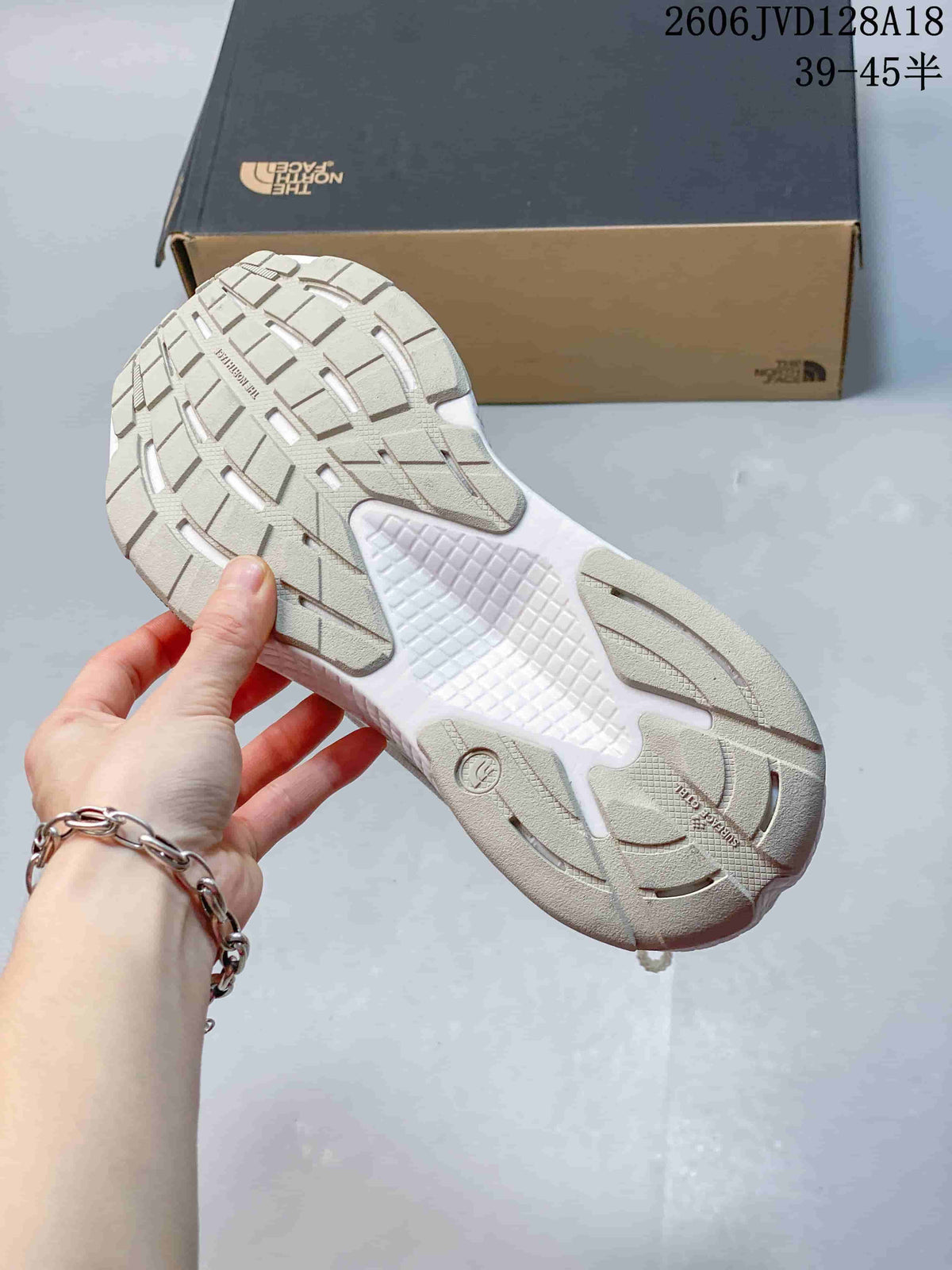 Underside of a running shoe showing segmented outsole tread