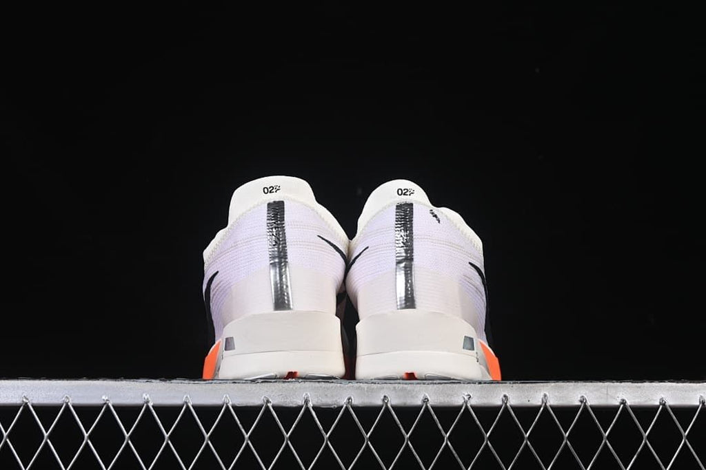 Rear view of the pair showing the heel panels and reflective strips.
