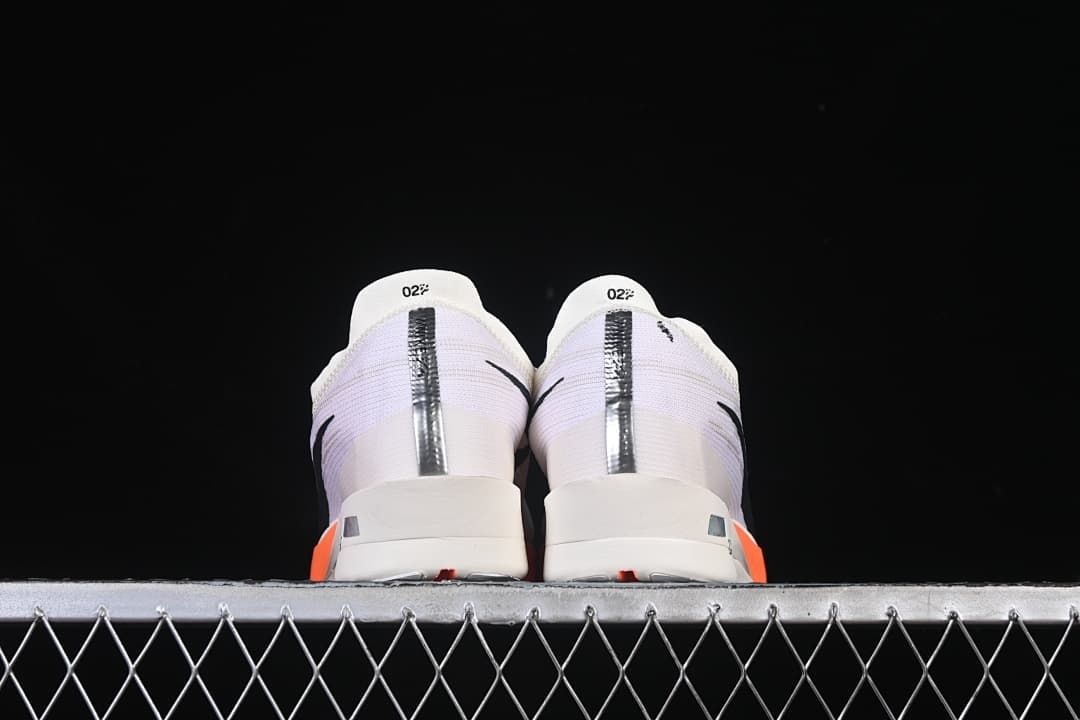 Rear view of the pair showing the heel panels and reflective strips.