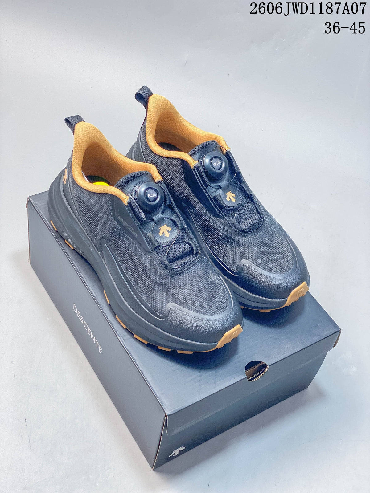 Pair of dark navy Descente trail shoes with mustard-yellow accents and BOA dial closures