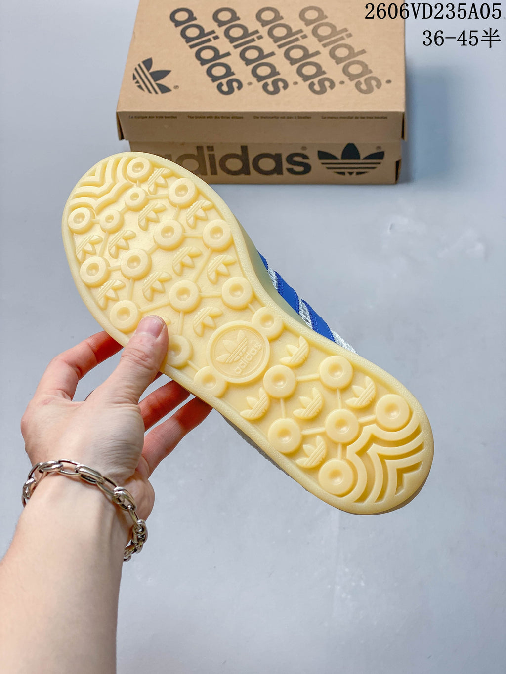 Underside of a sneaker showing a patterned gum-look outsole