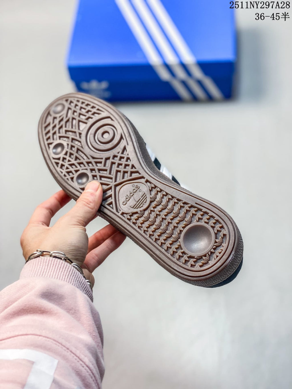 Close-up of the brown patterned outsole on an Adidas Handball Spezial sneaker.