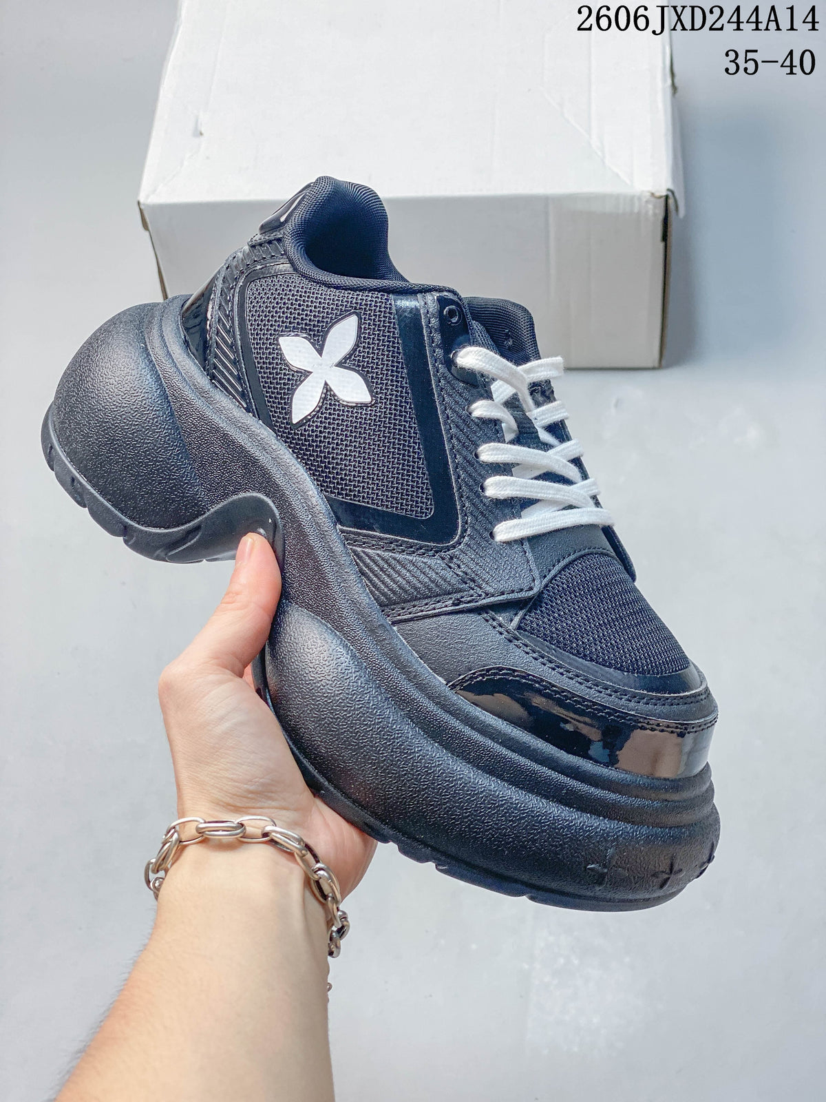 Side view of a dark navy SMFK sneaker