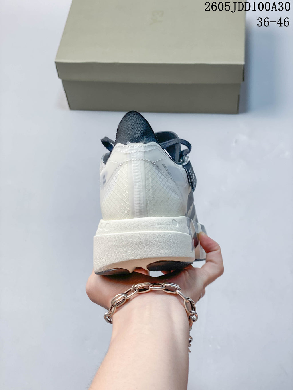 Rear view of the running shoe with a white heel and sculpted midsole
