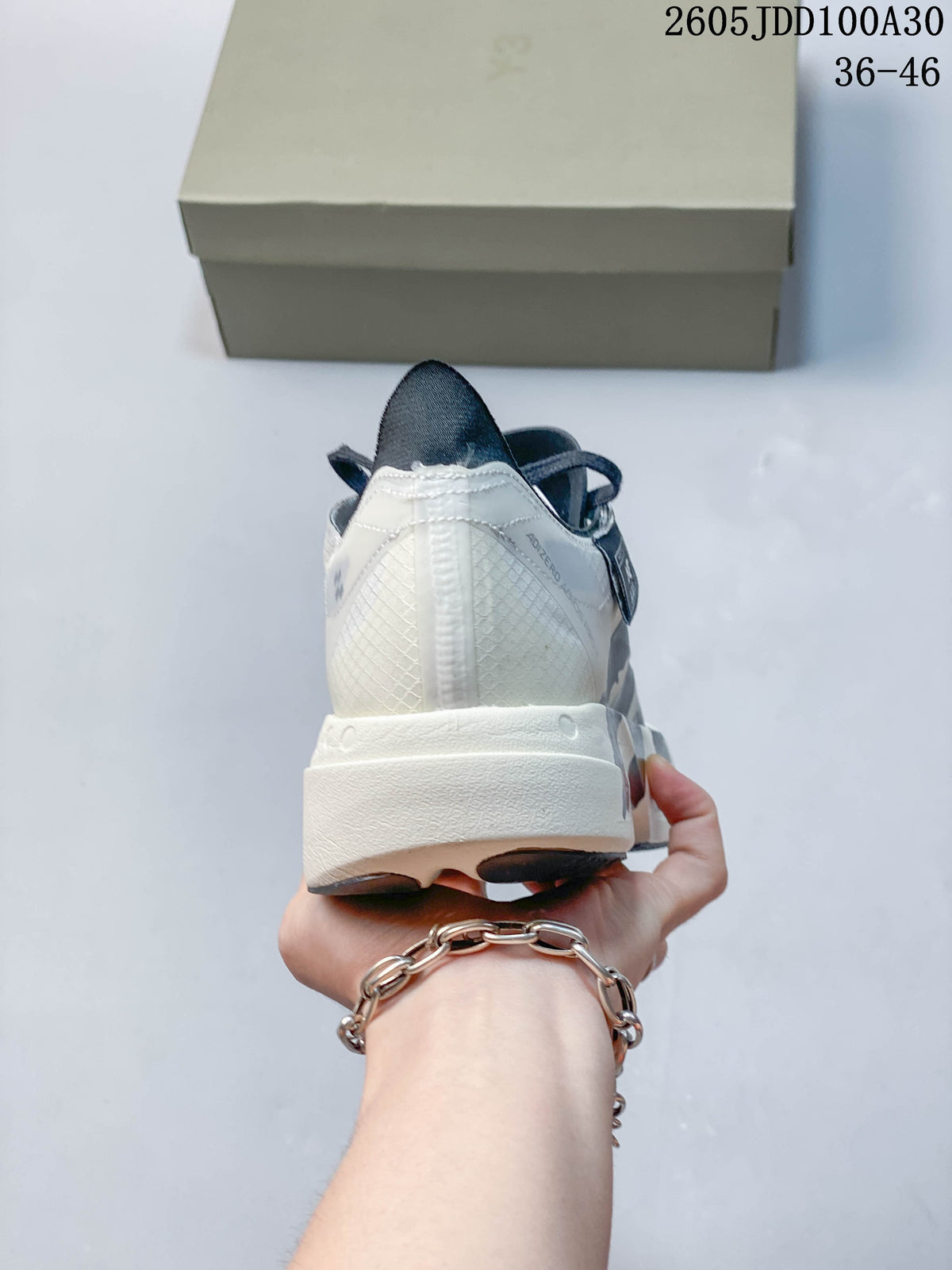 Rear view of the running shoe with a white heel and sculpted midsole