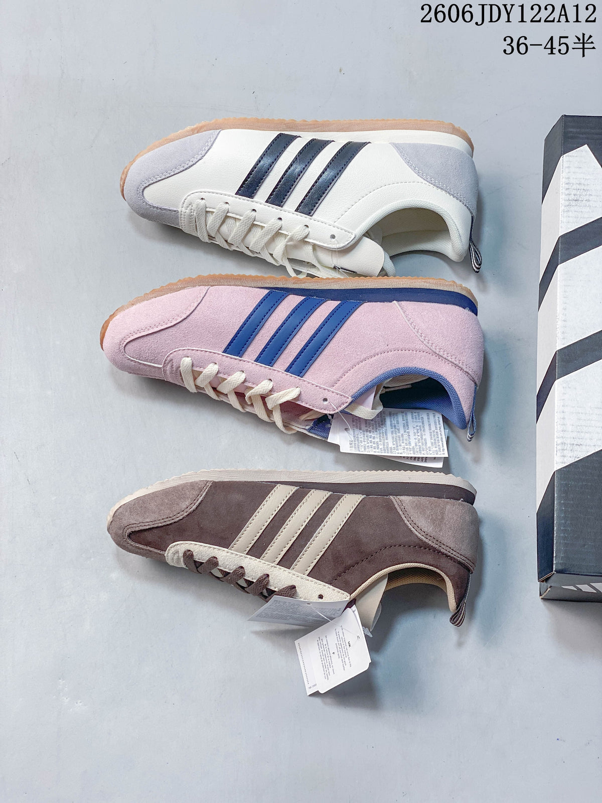 Three Adidas Originals VS JOG 2.0 sneakers shown in cream, pink, and taupe colorways