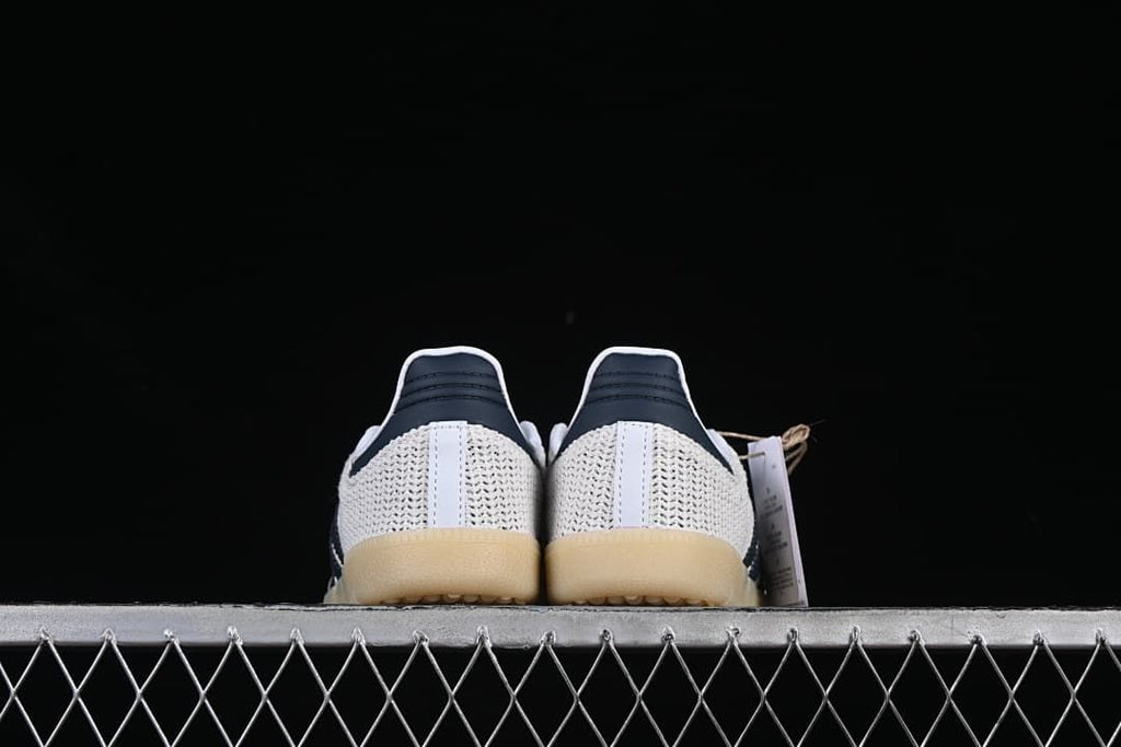 Rear view of the pair showing navy heel details and gum-look soles
