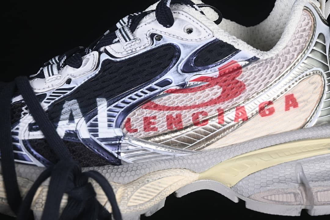 Close-up of the sneaker's side panels and red Balenciaga branding.