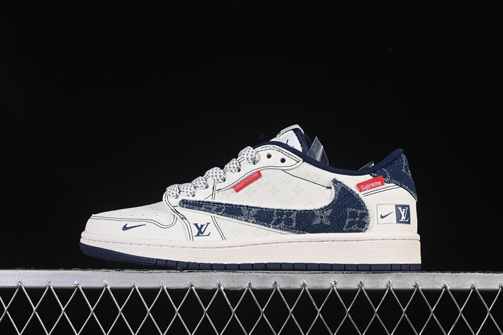 Side view of a white and navy low-top sneaker with denim-look Swoosh panels and graphic accents