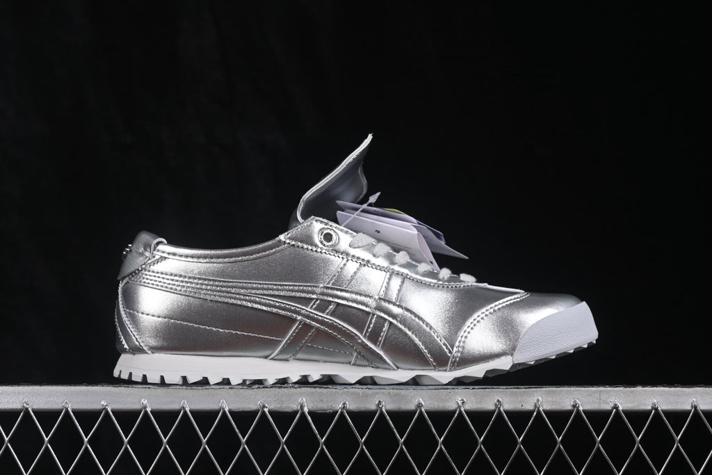 Side profile of a silver Onitsuka Tiger Mexico 66 Golf sneaker with tonal side stripes and white outsole.