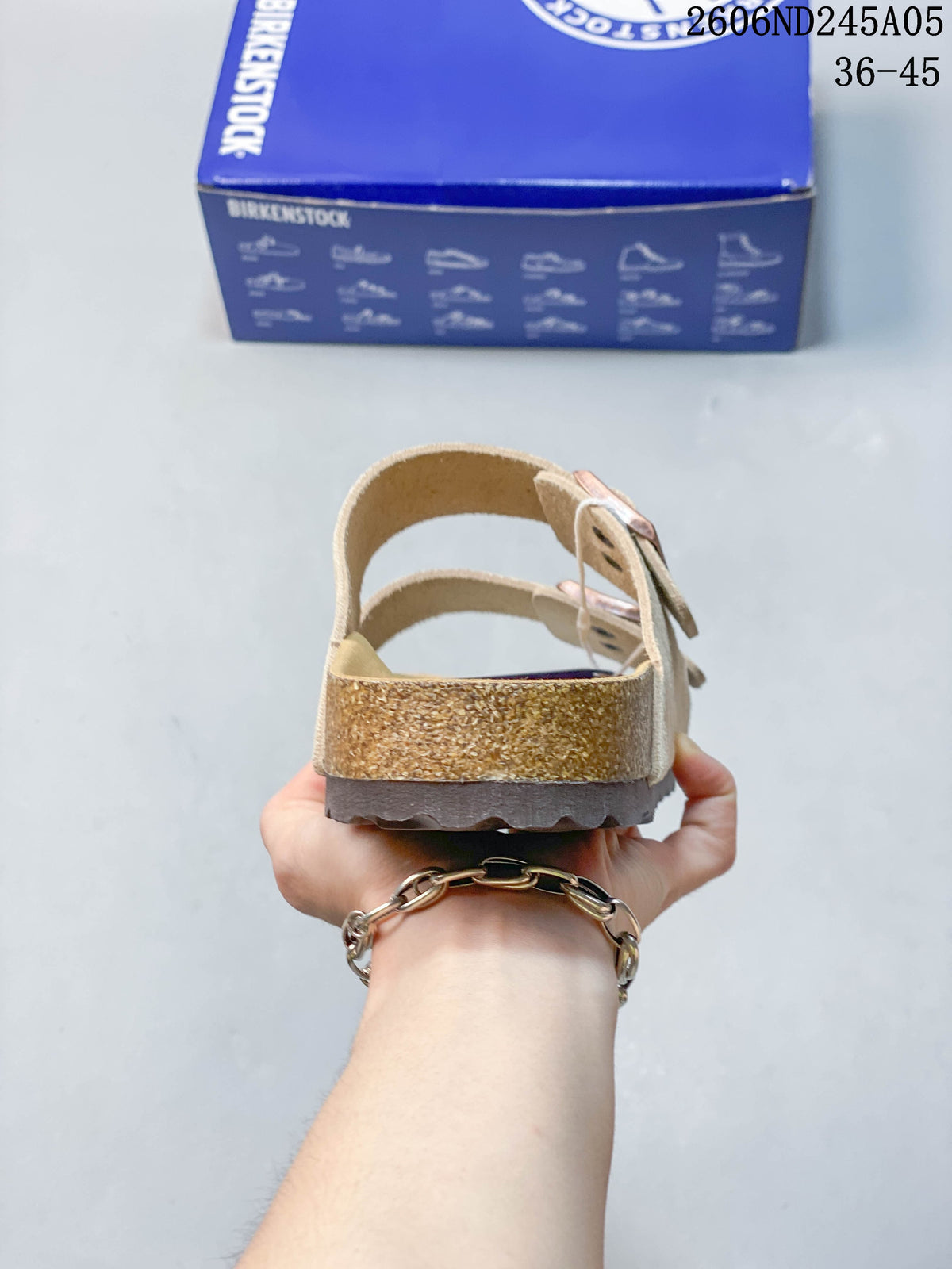 Rear view showing the sandal heel and layered sole.