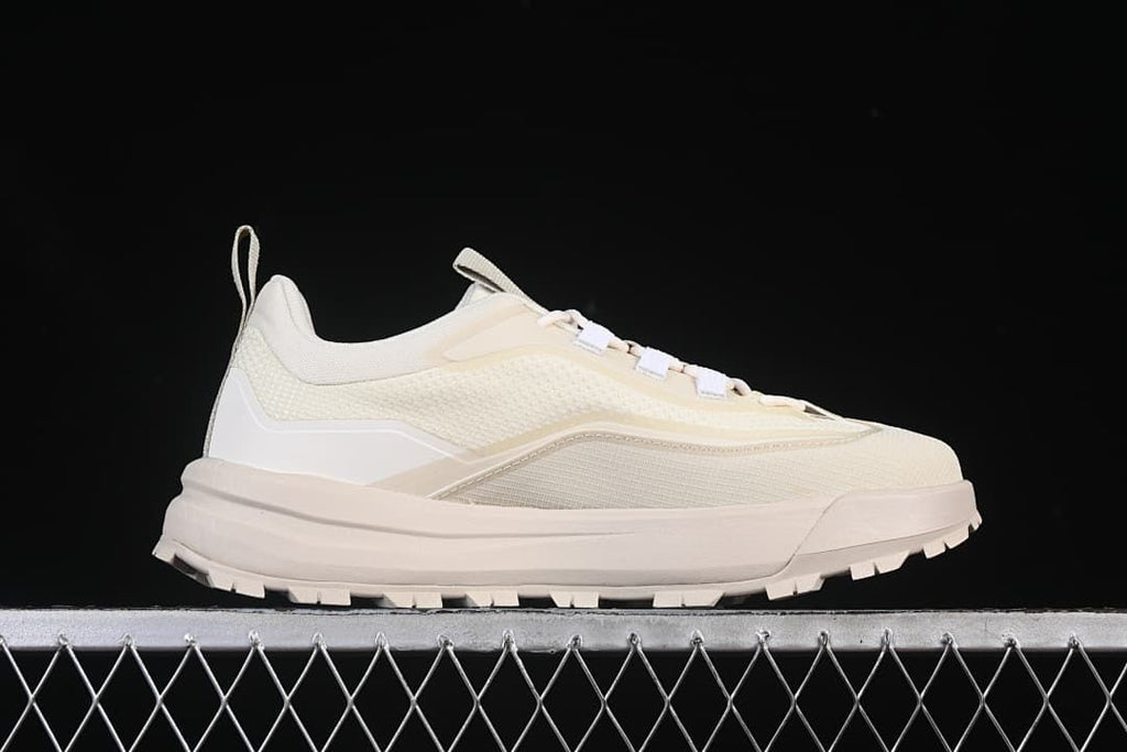 Side profile of the low-cut shoe and its thick, treaded sole
