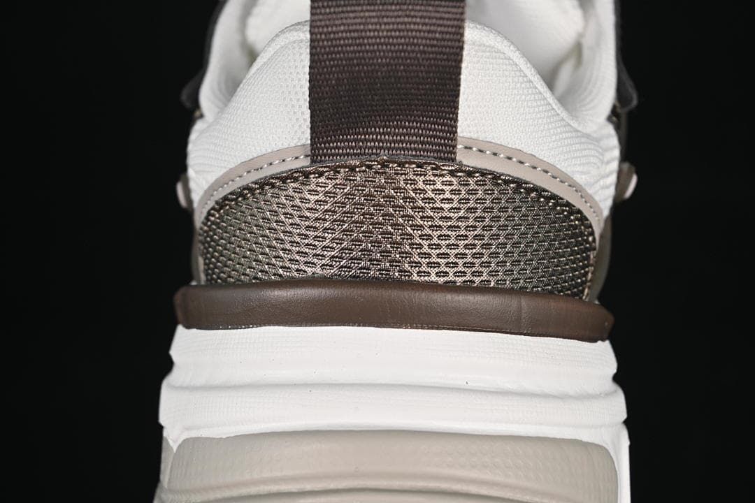 Rear view showing the heel panel, pull tab, and layered sole