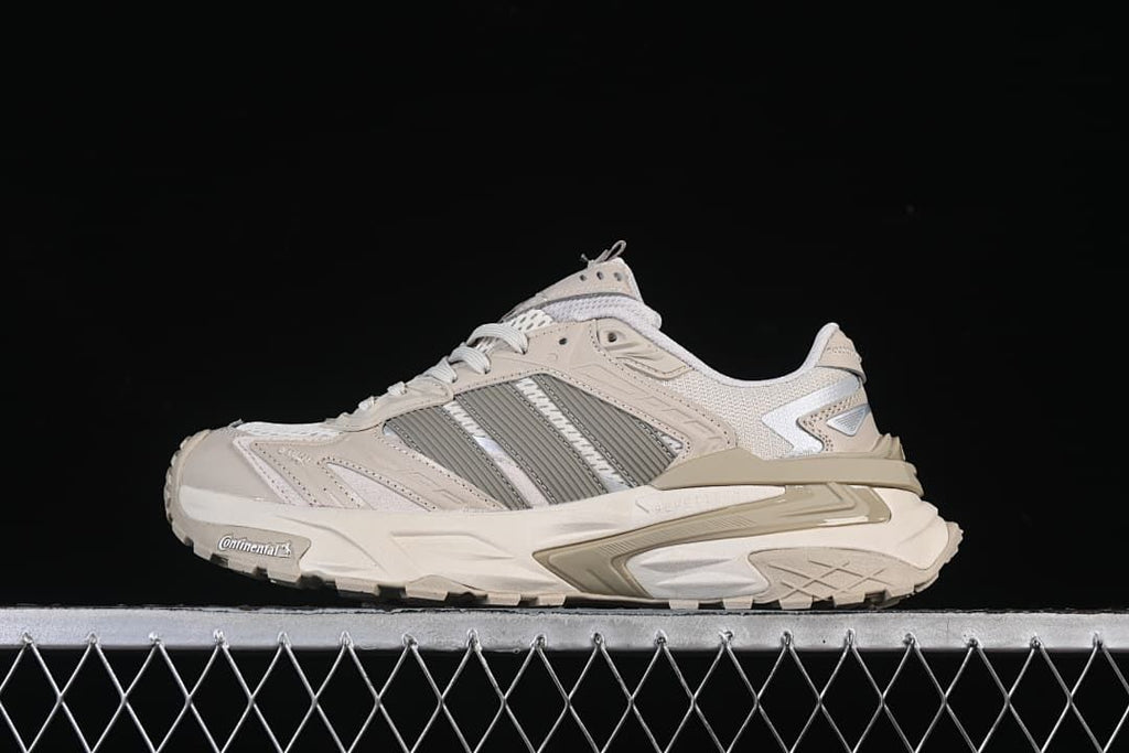 Side view of the beige and gray Adidas XLG Storm Edge sneaker