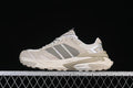 Side view of the beige and gray Adidas XLG Storm Edge sneaker