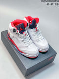 Pair of white, red, and dark-accent Jordan Air Jordan 5 high-top sneakers on a shoe box