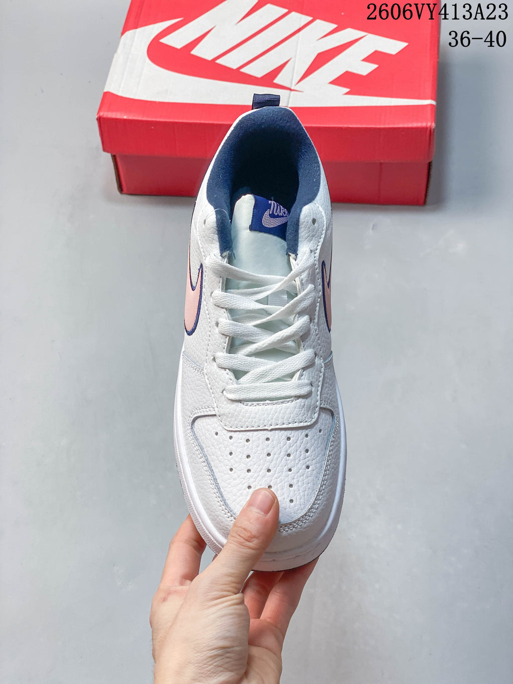 Top view showing the laces and perforated toe of a white NikeCourt Borough 2 Low sneaker