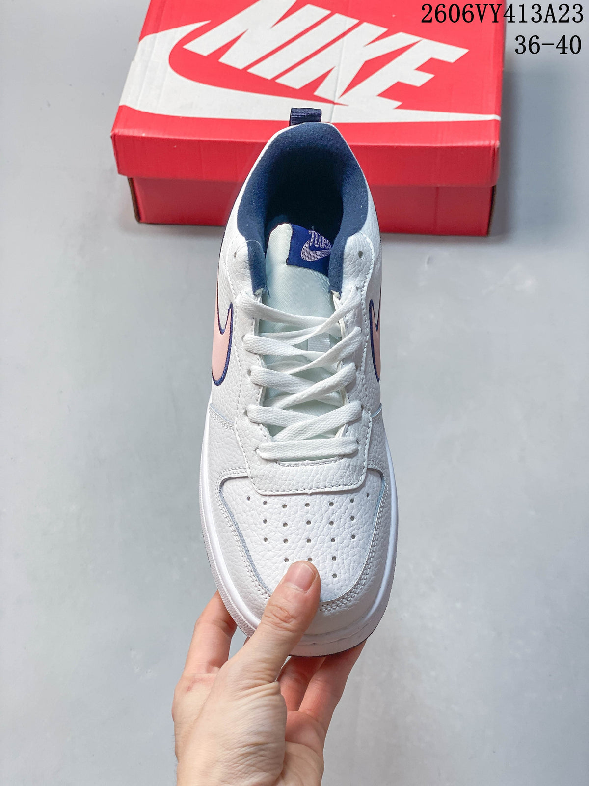 Top view showing the laces and perforated toe of a white NikeCourt Borough 2 Low sneaker
