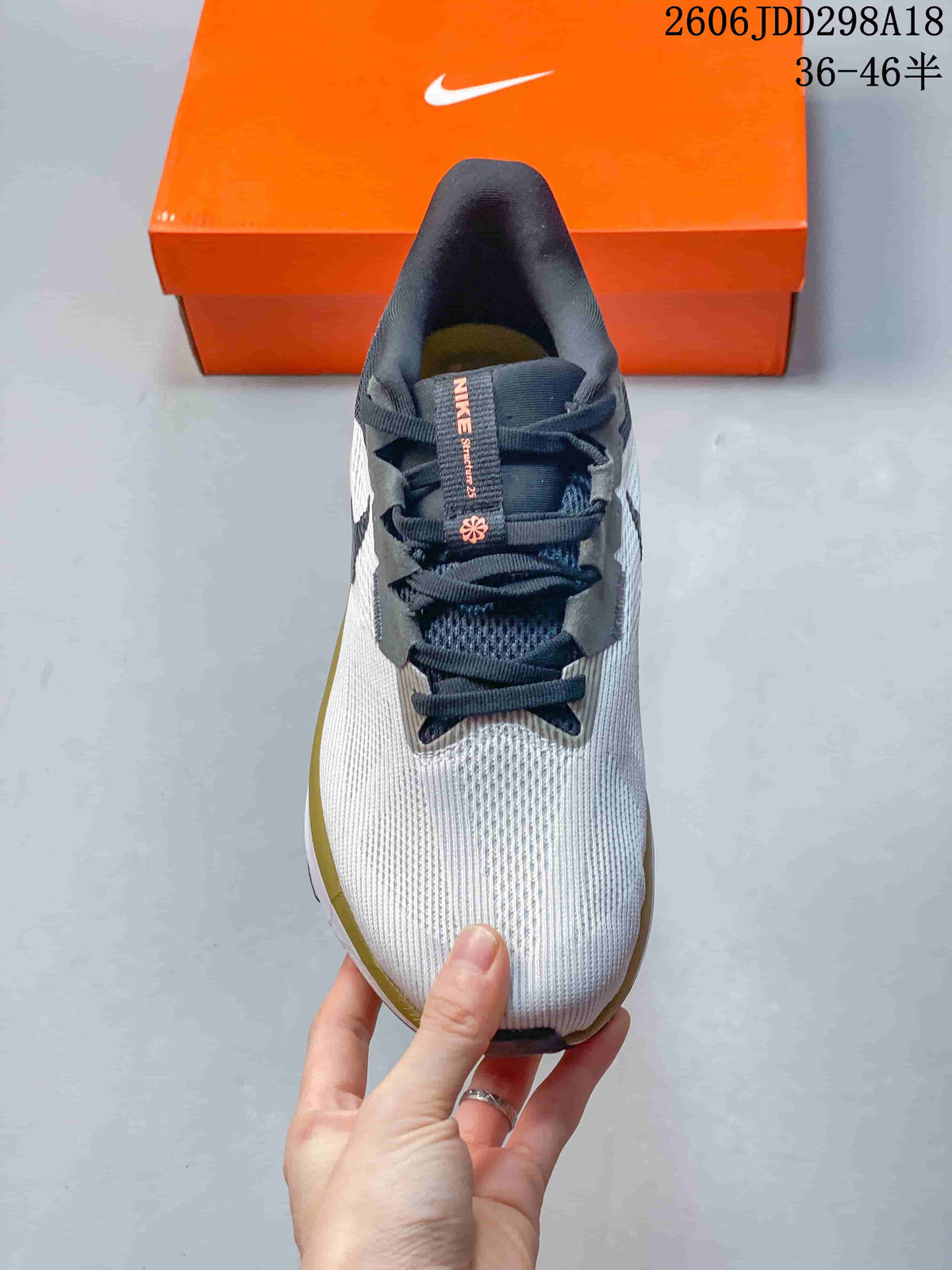 Top view showing the laces, tongue and textured white forefoot.
