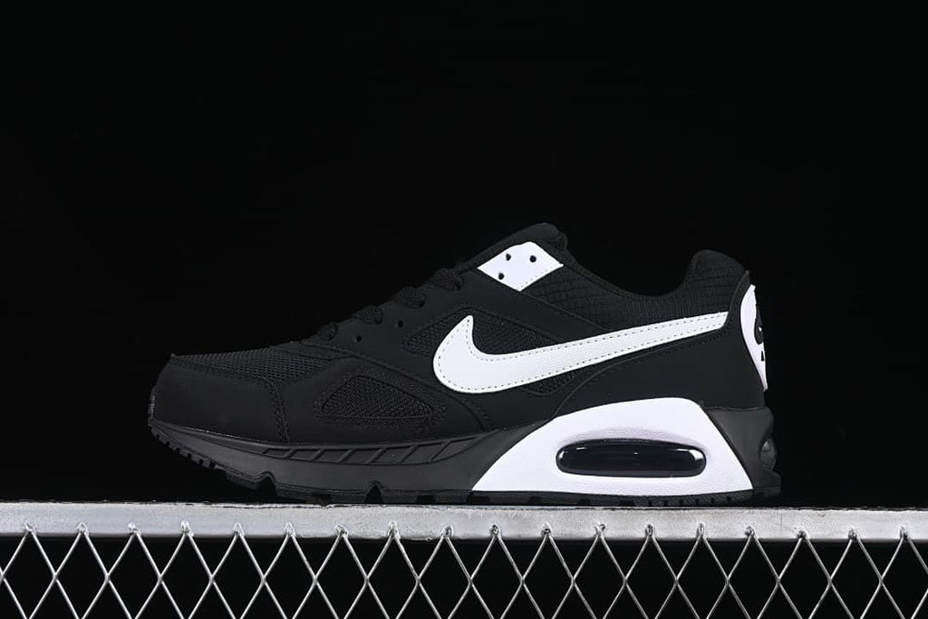 Side profile of a black and white Nike Air Max Correlate sneaker