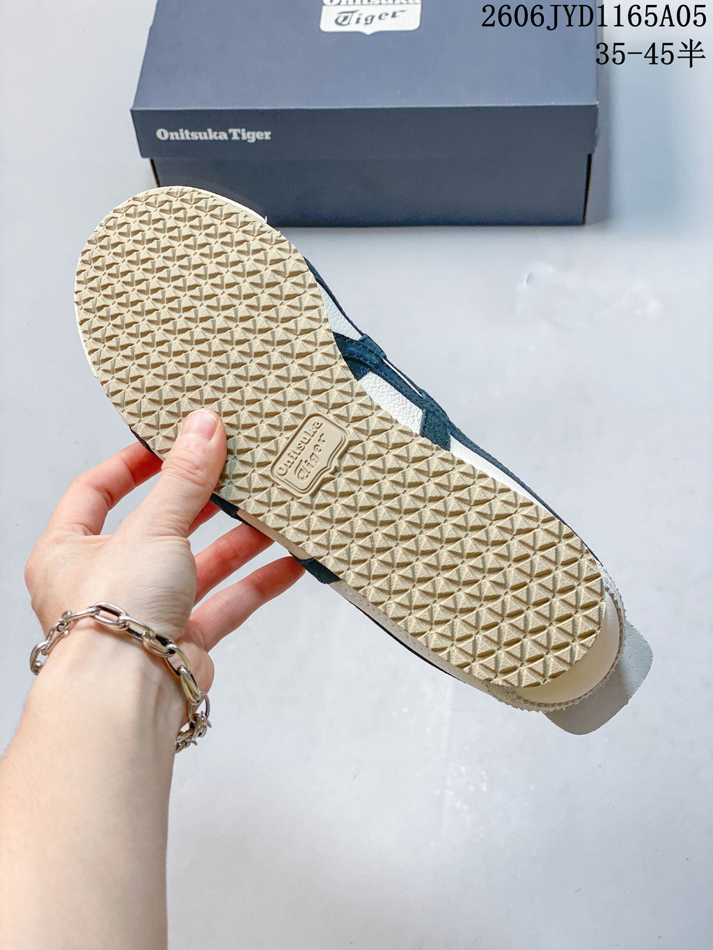 Close-up of the textured light-colored outsole on an Onitsuka Tiger Mexico 66 sneaker.