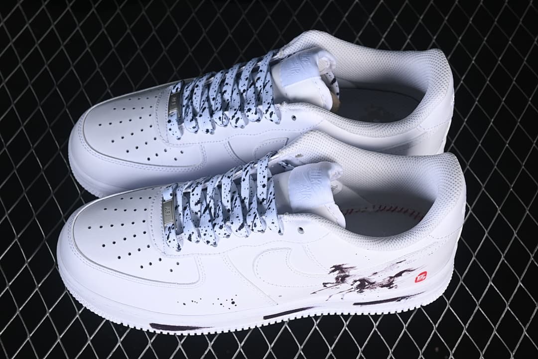 Angled view of the pair showing the graphic sides and lace pattern