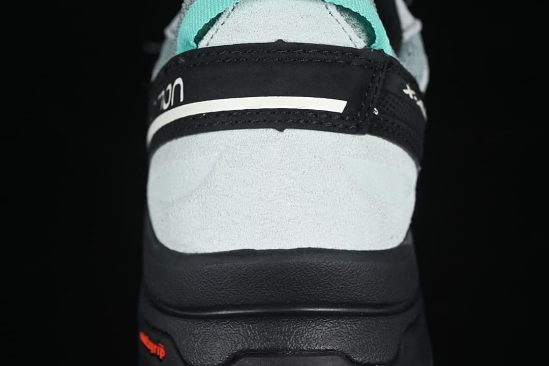 Rear view showing the heel overlay, pull tab, and outsole.