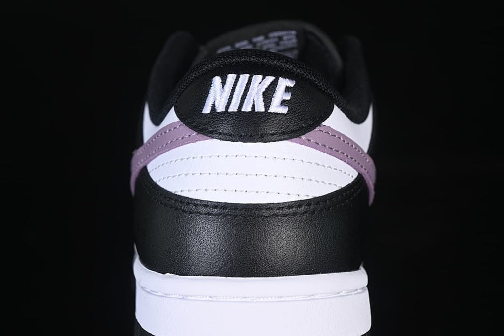 Rear view showing black, white, and purple heel panels