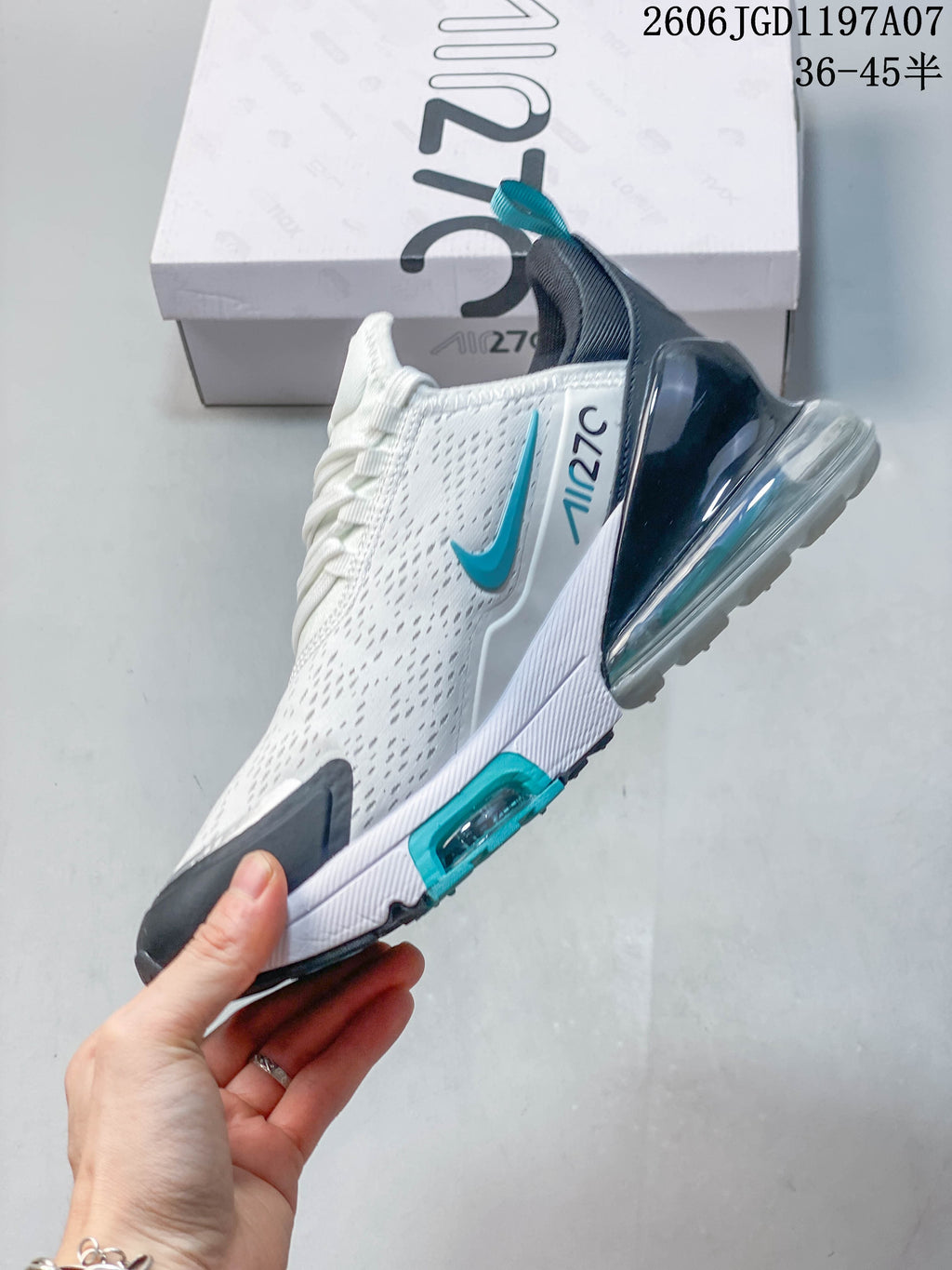 Side view of the Nike Air Max Pulse with white upper, teal accents, and visible heel cushioning