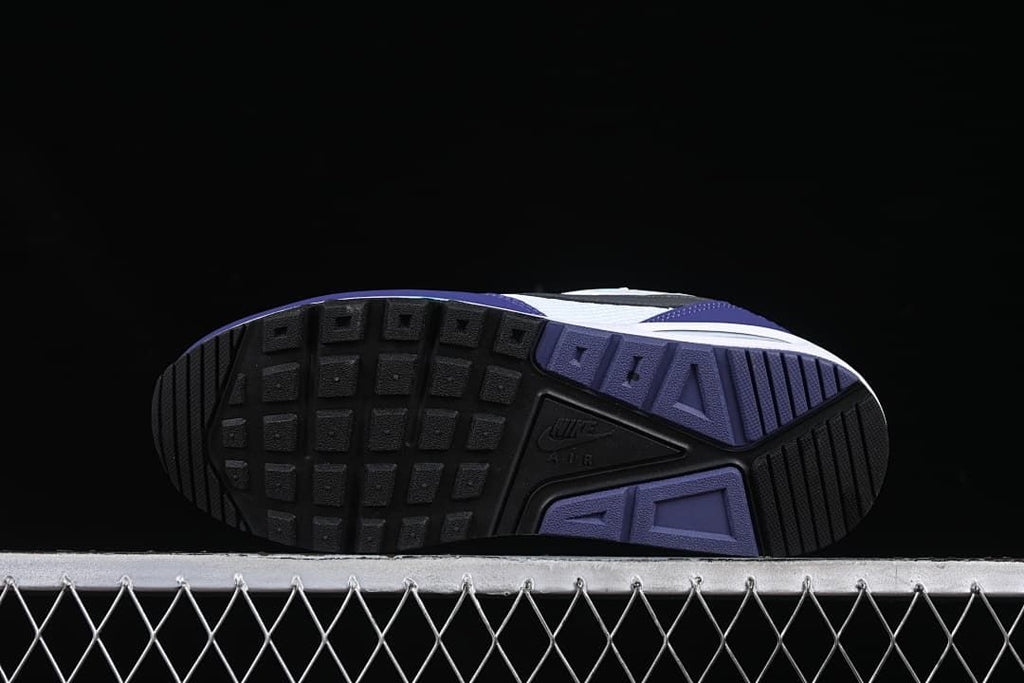 Underside view showing the patterned black and purple outsoles