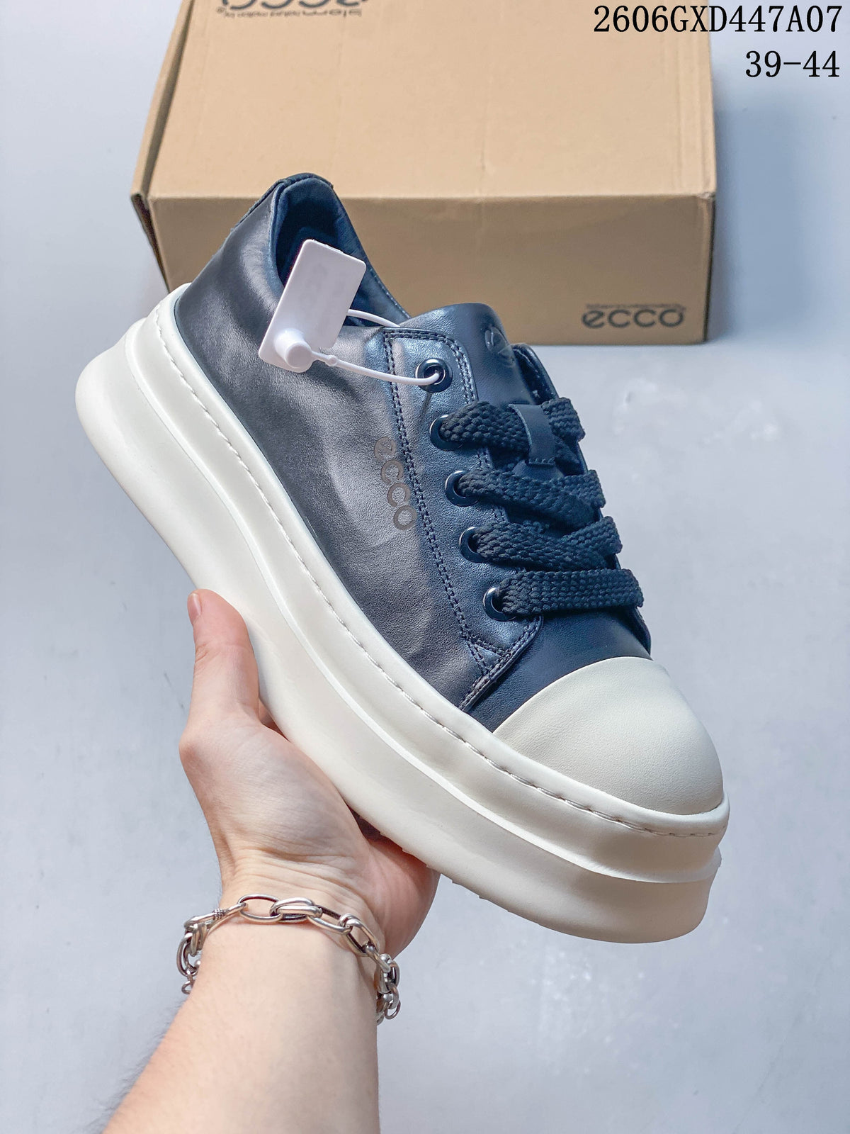 Angled side view of the navy and white platform sneaker