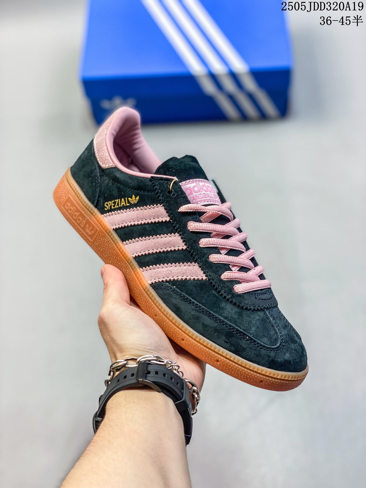 Angled side view highlighting the pink stripes and gum-colored sole