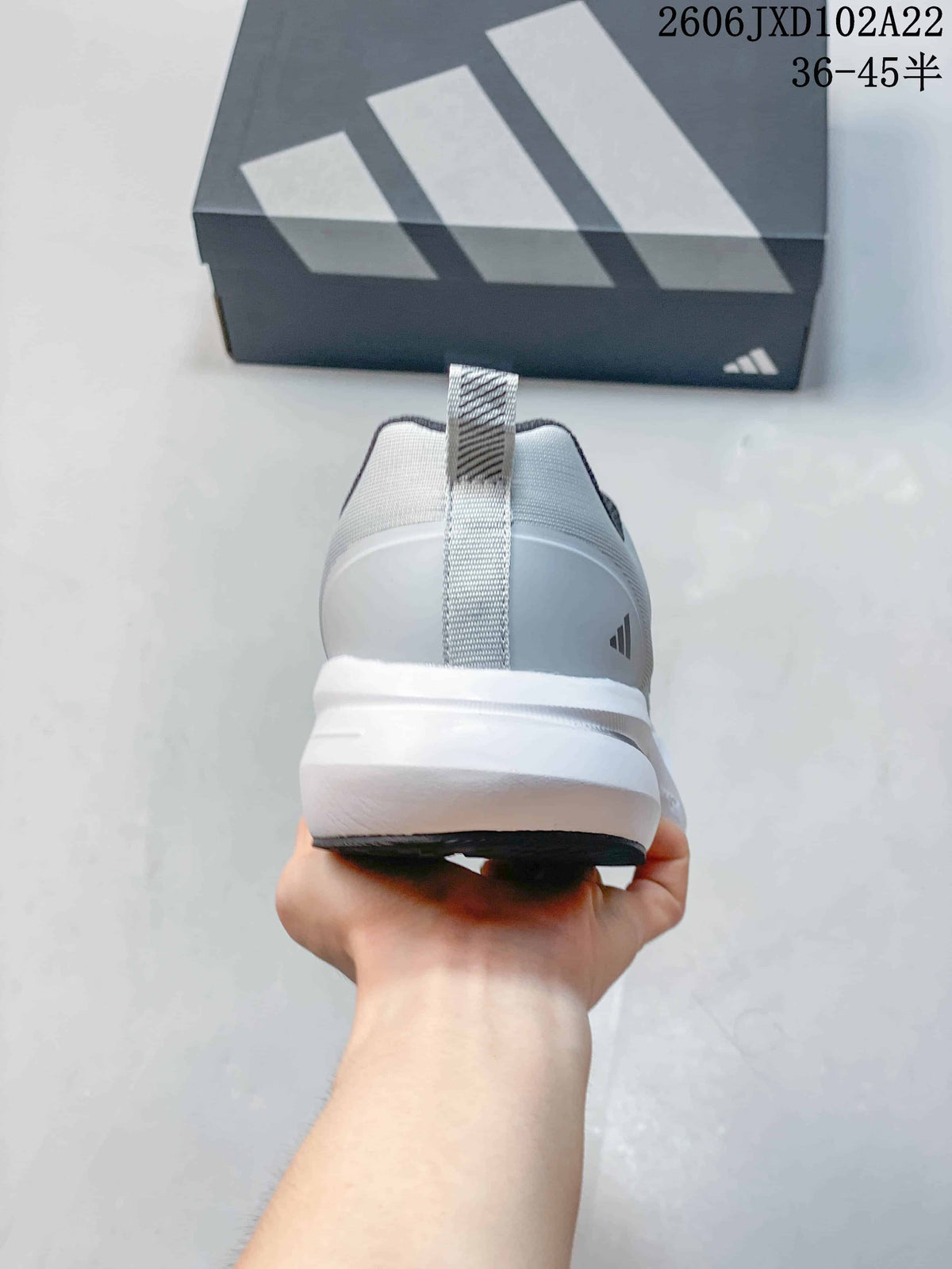 Rear view showing the heel, pull tab, and white sole