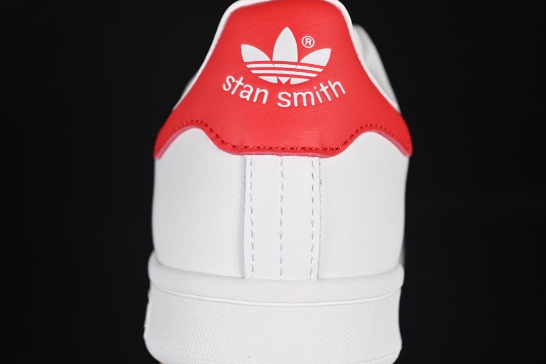 Rear view of the sneaker with a red Stan Smith heel tab