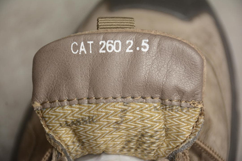 Close-up of the shoe tongue, with CAT 260 2.5 printed on it.