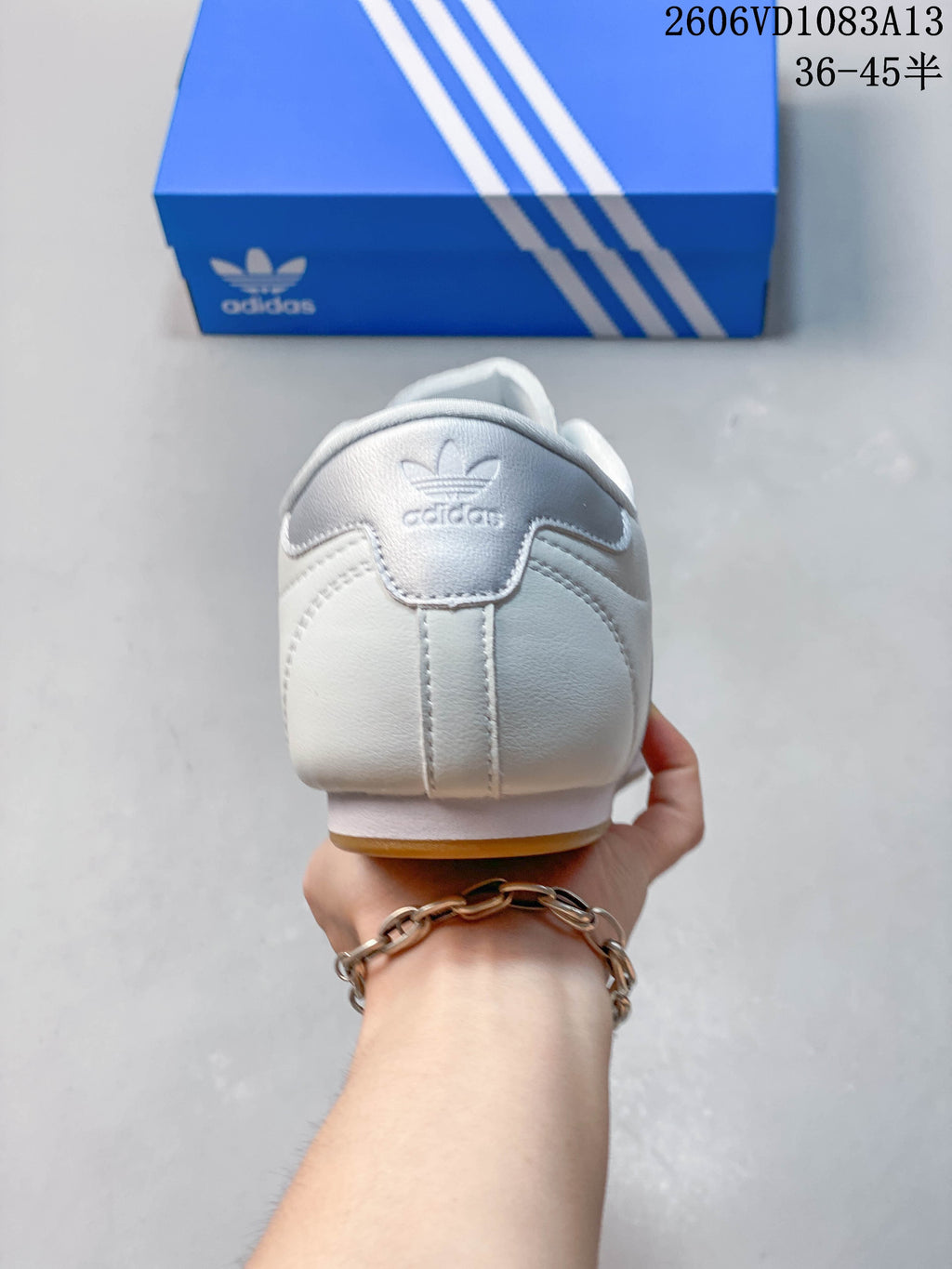 Rear view showing the silver-tone heel panel and adidas Trefoil branding.