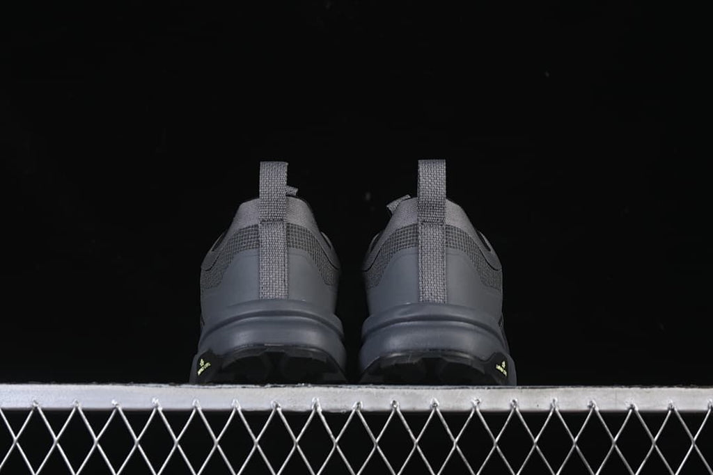 Rear view of both shoes showing heel pull tabs