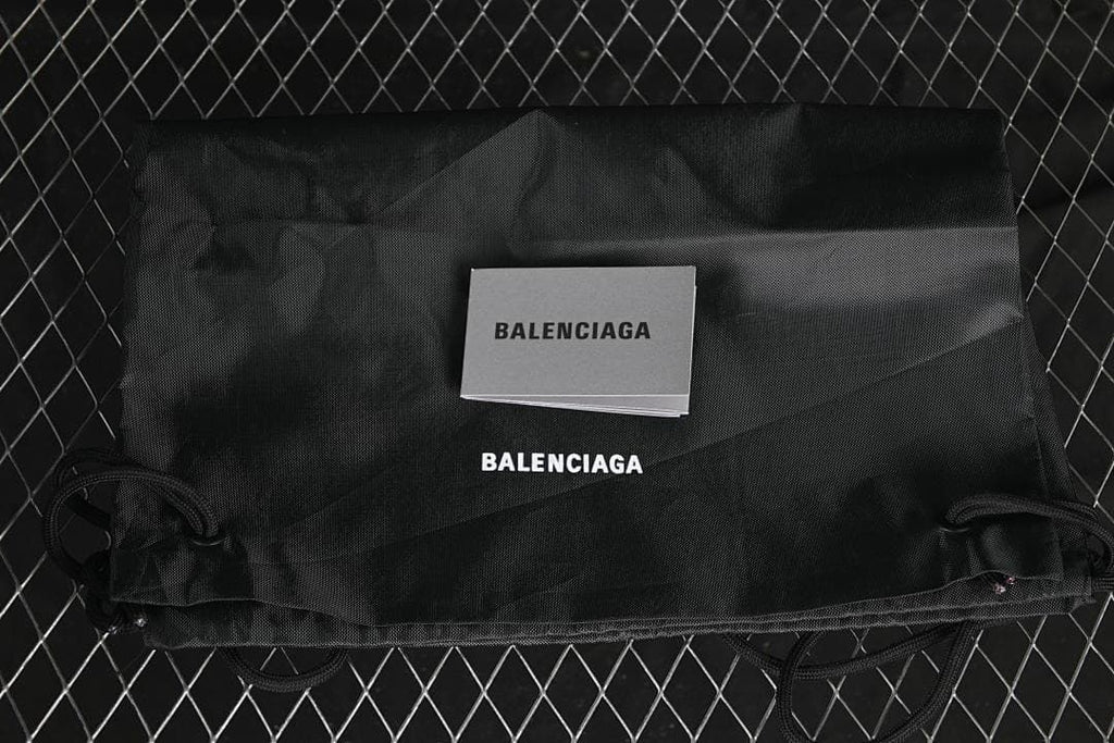 Black Balenciaga-branded dust bag and booklet