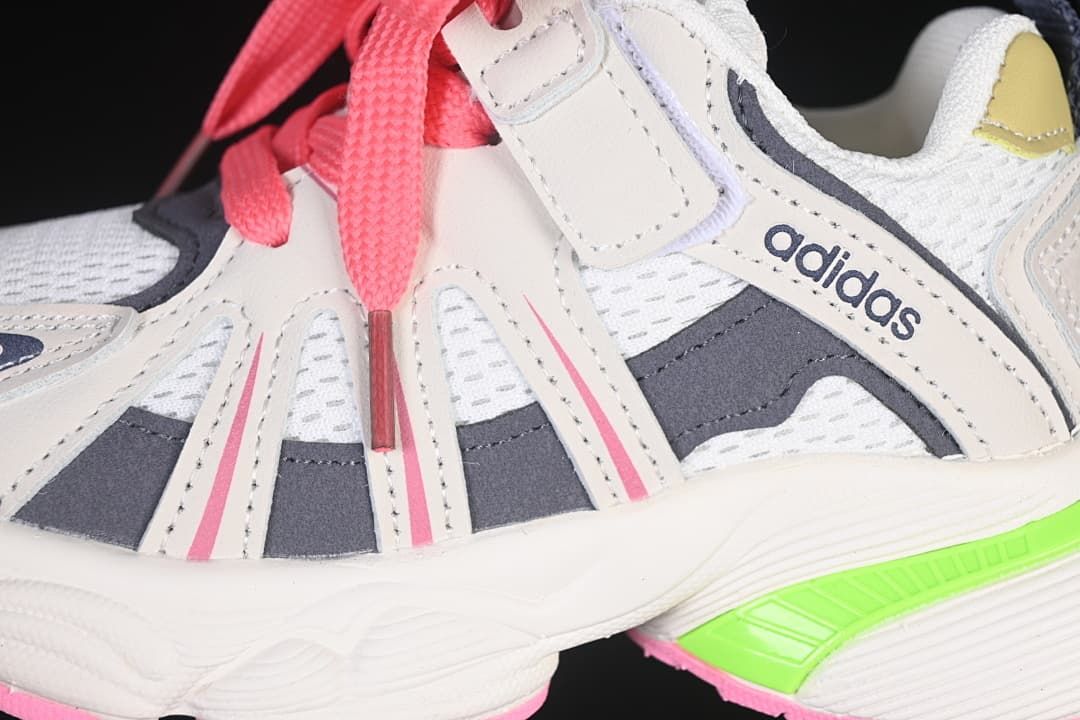 Close-up of the sneaker’s side panels, mesh sections, pink laces and hook-and-loop strap.