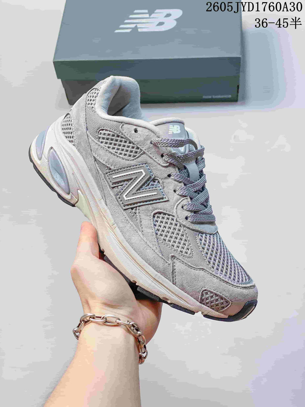 Angled side view of a grey New Balance 2010 sneaker