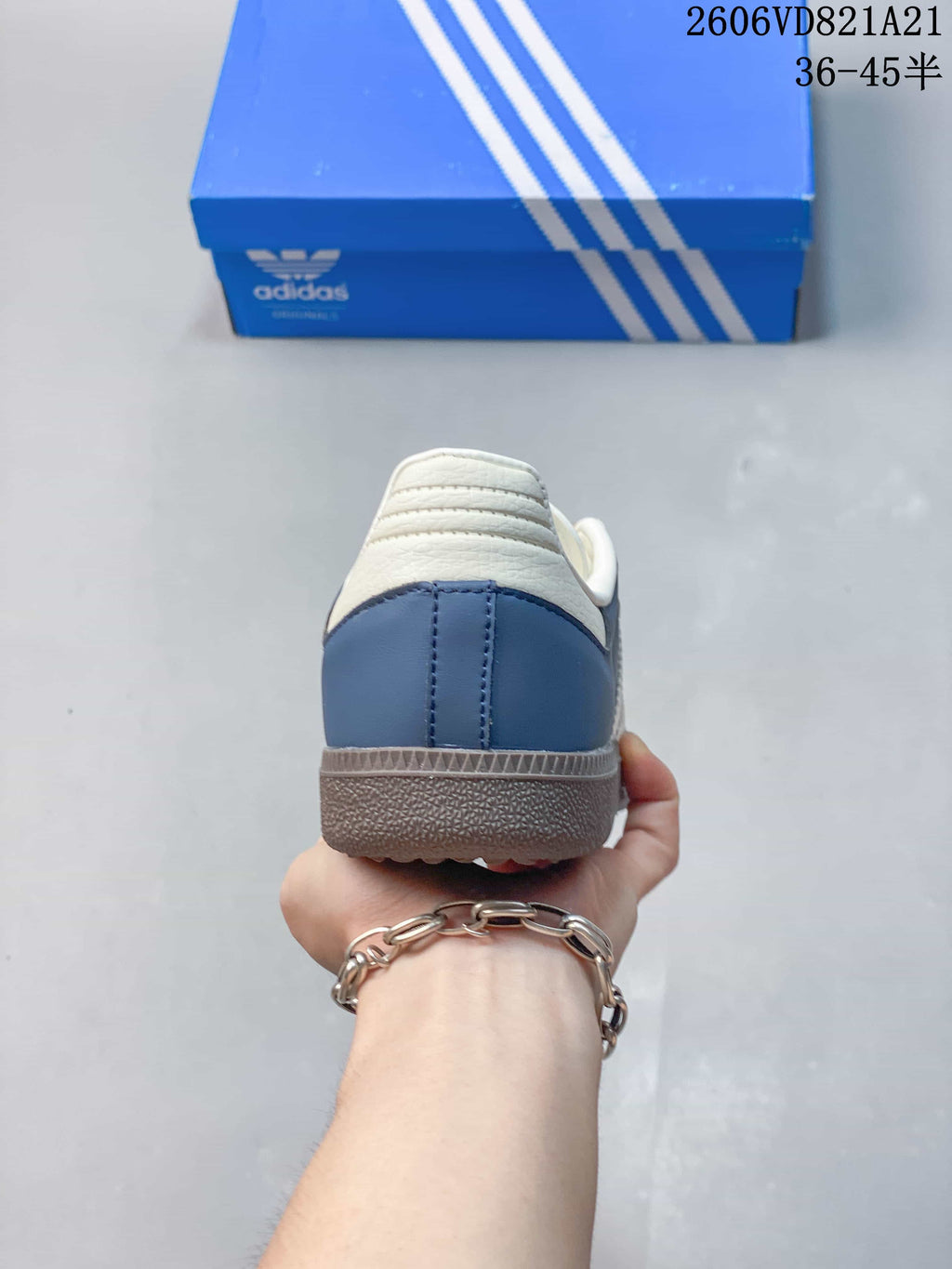 Rear view showing the blue heel panel and gum-tone outsole