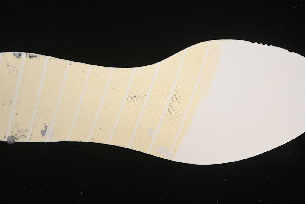 Underside detail showing the patterned outsole of the running shoe.